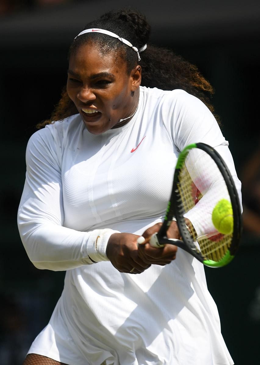 US player Serena Williams returns against Germany's Julia Goerges during their women's singles semi-final match on the tenth day of the 2018 Wimbledon Championships at The All England Lawn Tennis Club in Wimbledon, southwest London, on July 12, 2018. / AF