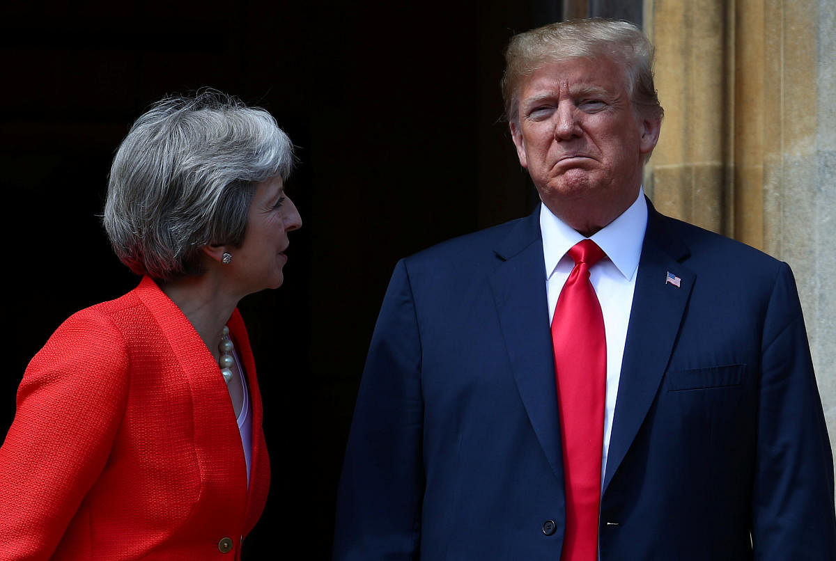 Britain's Prime Minister Theresa May poses for a photograph with U.S. President Donald Trump at Chequers near Aylesbury, Britain July 13, 2018. REUTERS.