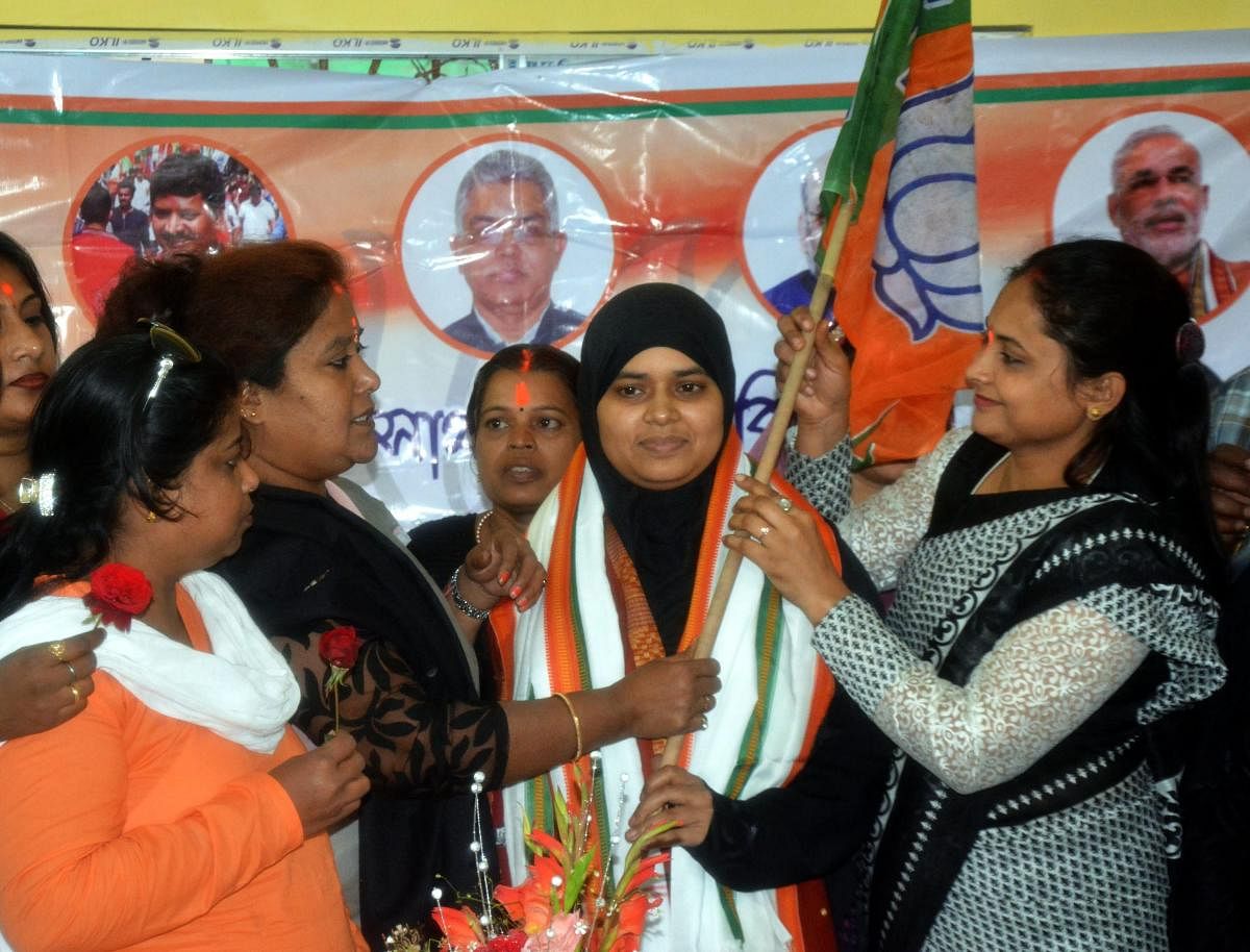 Ishrat Jahan(C), one of the petitioner in the triple Talaq case joins the BJP at party office in Howrah district of West Bengal on Saturday. PTI file photo.