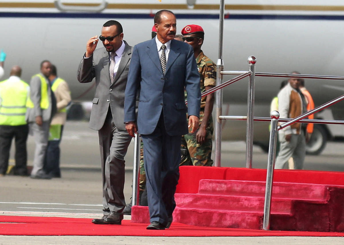  Isaias Afwerki is welcomed by Ethiopian Prime Minister Abiy Ahmed upon arriving for a three-day visit, at the Bole international airport in Addis Ababa, Ethiopia. Reuters