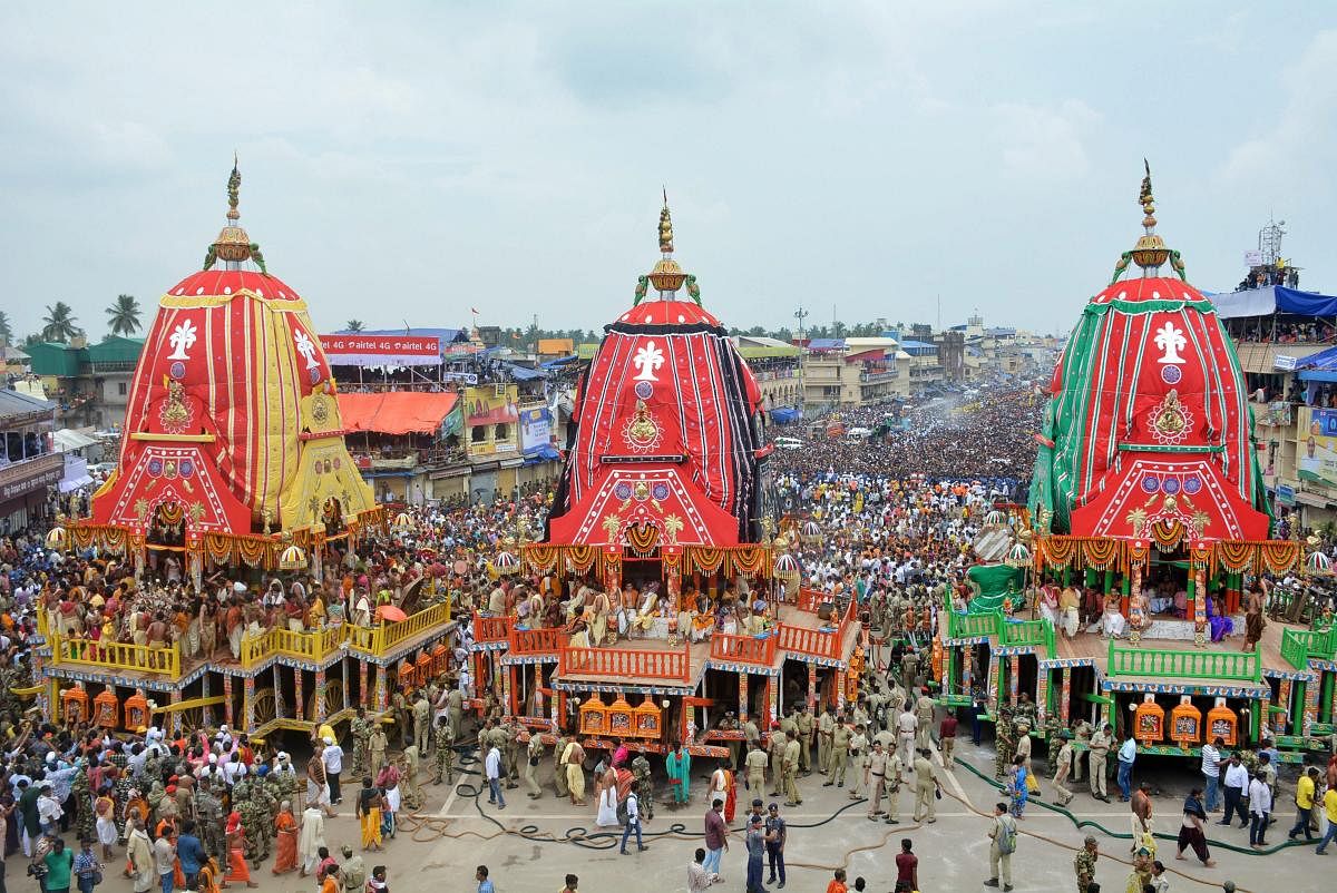  Devotees pull the chariots during the 141st Rath Yatra, in Puri on Saturday. PTI Photo