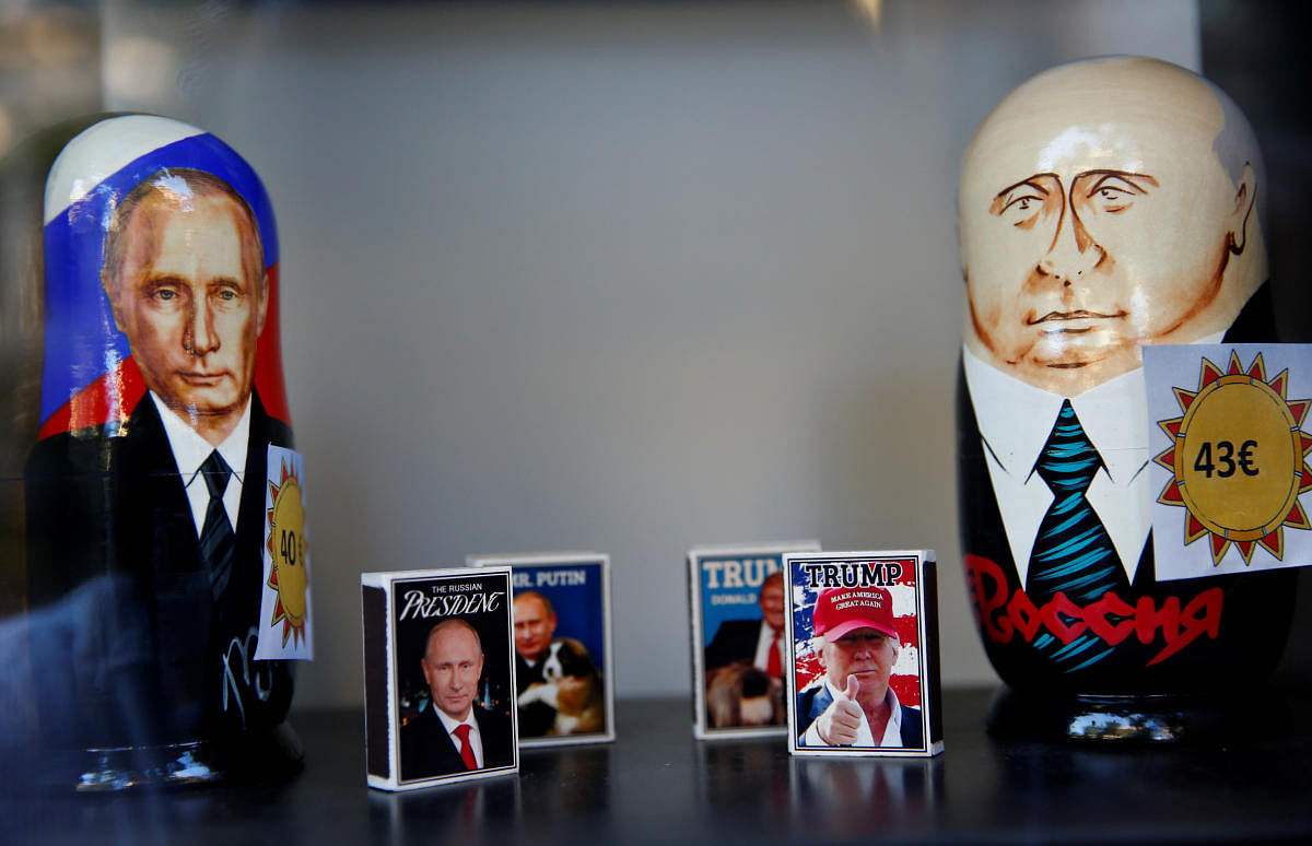 Matchboxes with pictures of President Vladimir Putin and President Donald Trump are seen in a shop window in Helsinki, Finland July 14, 2018. REUTERS.
