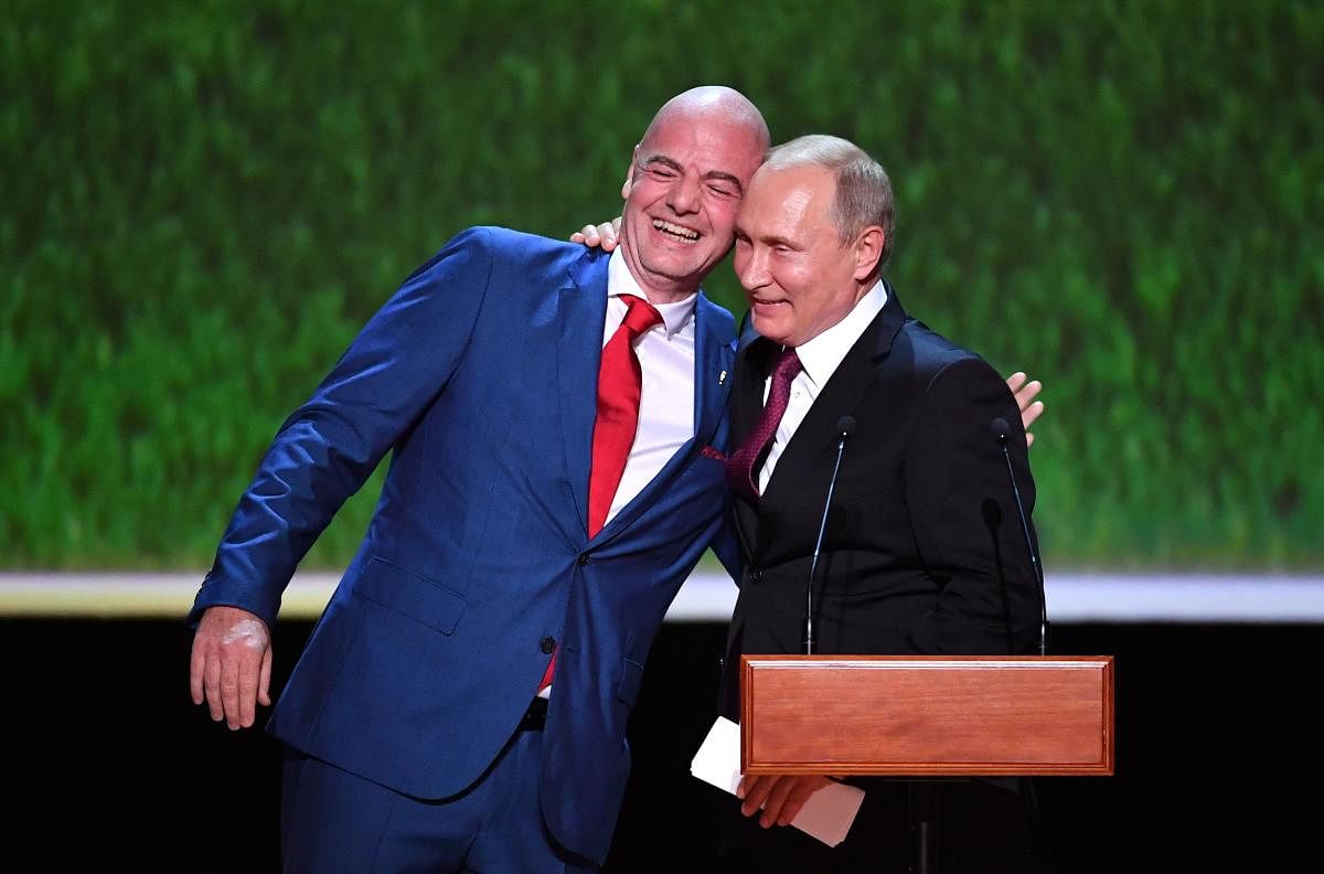  FIFA president Gianni Infantino (left) and Russian President Vladimir Putin share a laugh before a concert of opera stars in Moscow. AFP