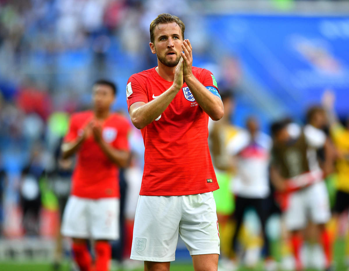 England's Harry Kane applauds fans after the match against Belgium on Saturday. (REUTERS/Dylan Martinez)