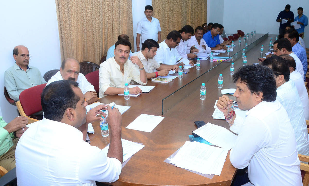 Minister for Urban Development U T Khader chairs a meeting of MLAs from Dakshina Kannada and Udupi districts on Monday. 