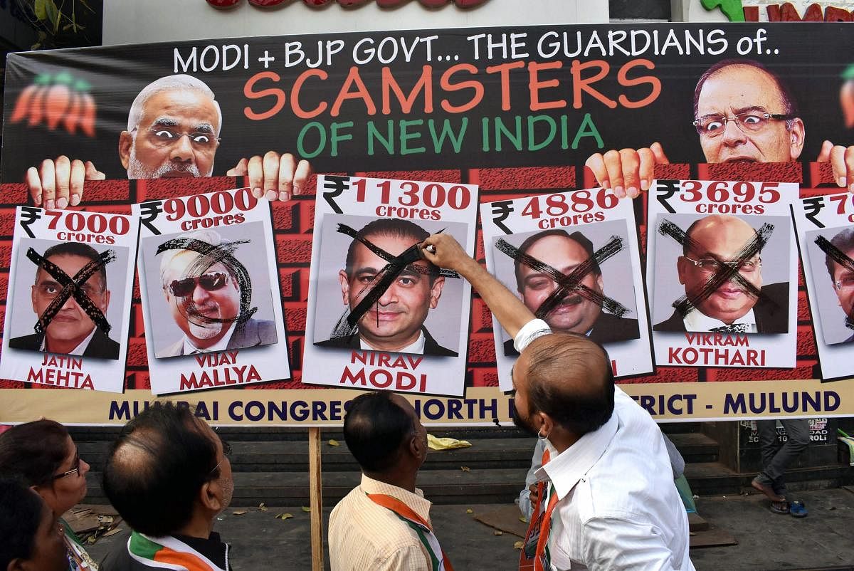Mumbai: NCP activists raise during a protest against Nirav Modi and the Punjab National Bank fraud case, in Mumbai on Friday. PTI Photo