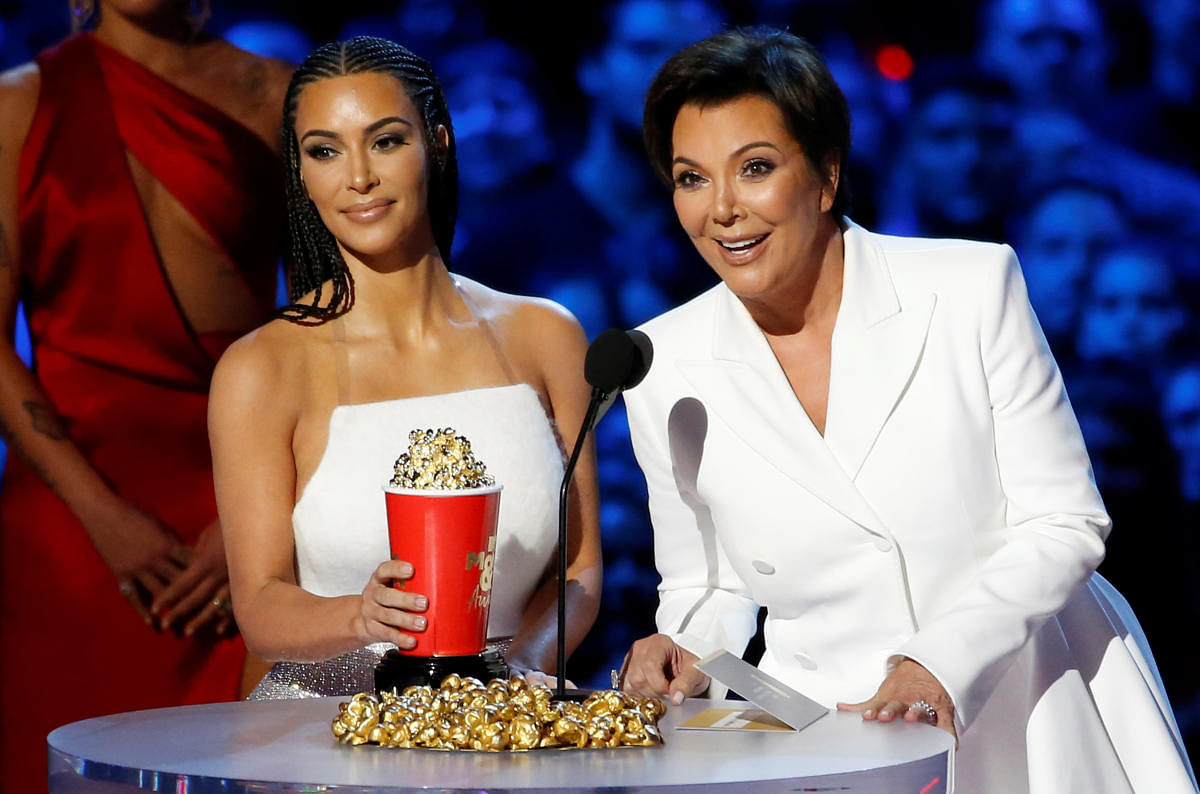 Reality stars Kim Kardashian (L) and Kris Jenner accept the award for Best Reality Series or Franchise at the 2018 MTV Movie &amp; TV Awards at Barker Hangar in Santa Monica, California, U.S., June 16, 2018. Picture taken June 16, 2018. REUTERS/Mario Anzu