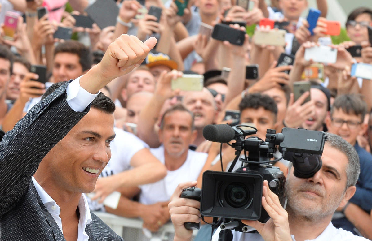THE BOSS IS HERE! Cristiano Ronaldo gestures as he arrives at the Juventus' medical centre in Turin on Monday. Reuters