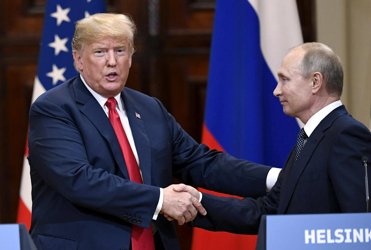 US President Donald Trump and Russia's President Vladimir Putin shake hands after their joint news conference in the Presidential Palace in Helsinki, Finland July 16, 2018. Reuters photo