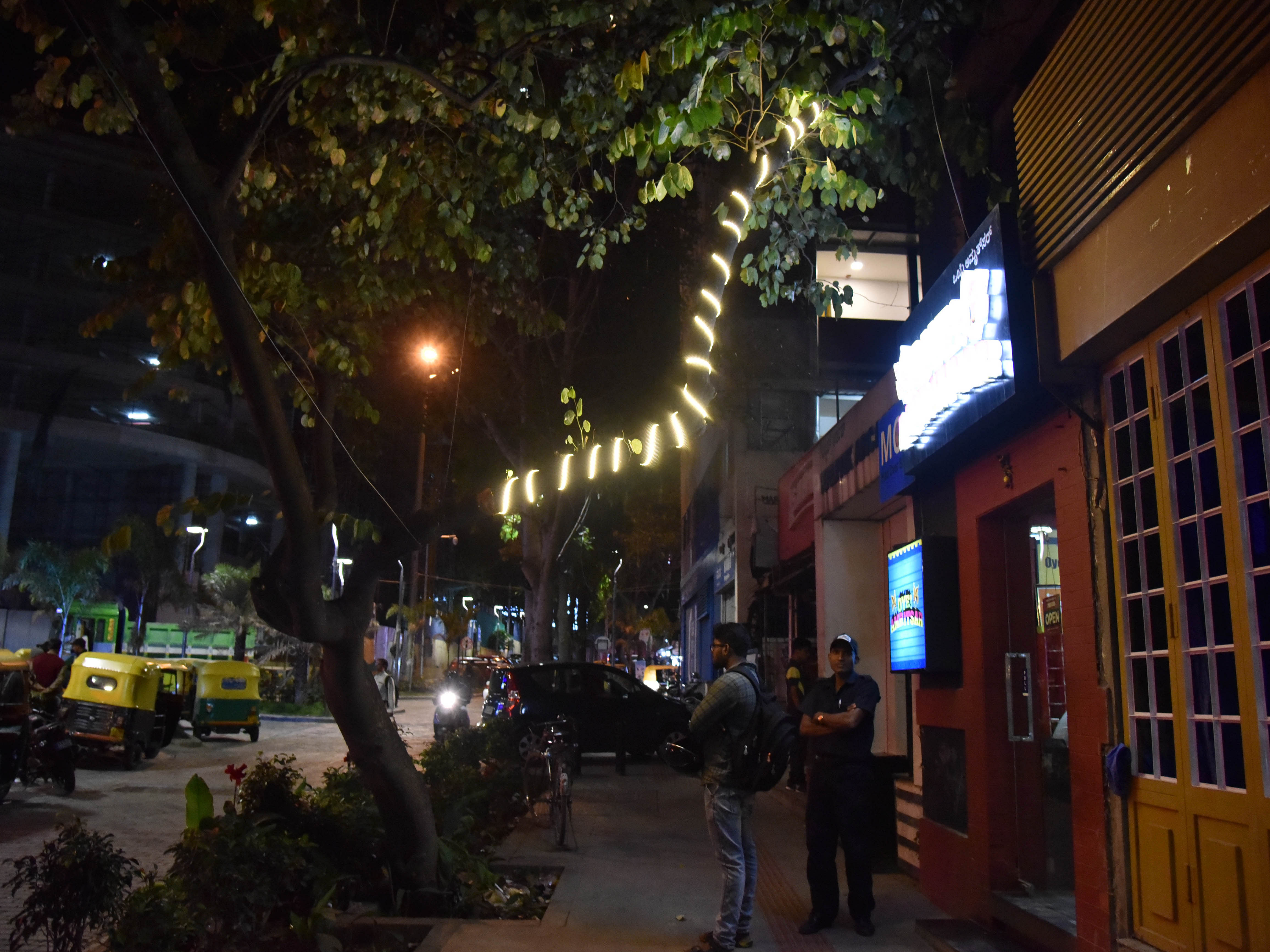 Lights on trees on Church street in front of Hotel Empire. DH Photos by B K Janardhan