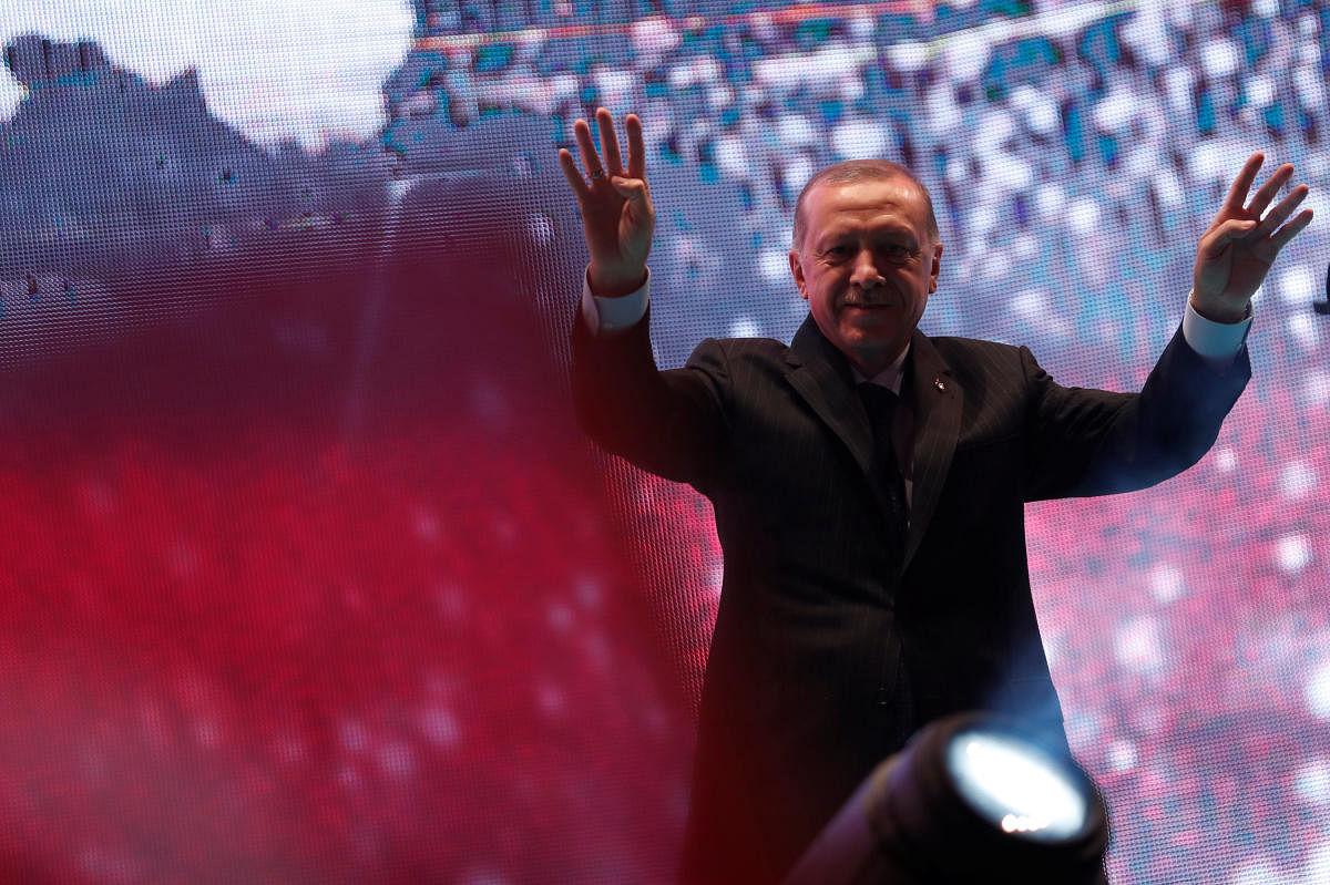 Turkish President Tayyip Erdogan greets his supporters during a ceremony marking the second anniversary of the attempted coup at the Bosphorus Bridge in Istanbul, Turkey, July 15, 2018. REUTERS photo.