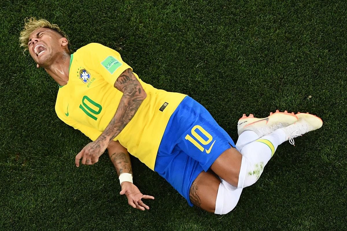 Neymar, lambasted at World Cup for his theatrical reactions to challenges, has taken a swipe at critics with a video in which he teaches children how to dive. AFP