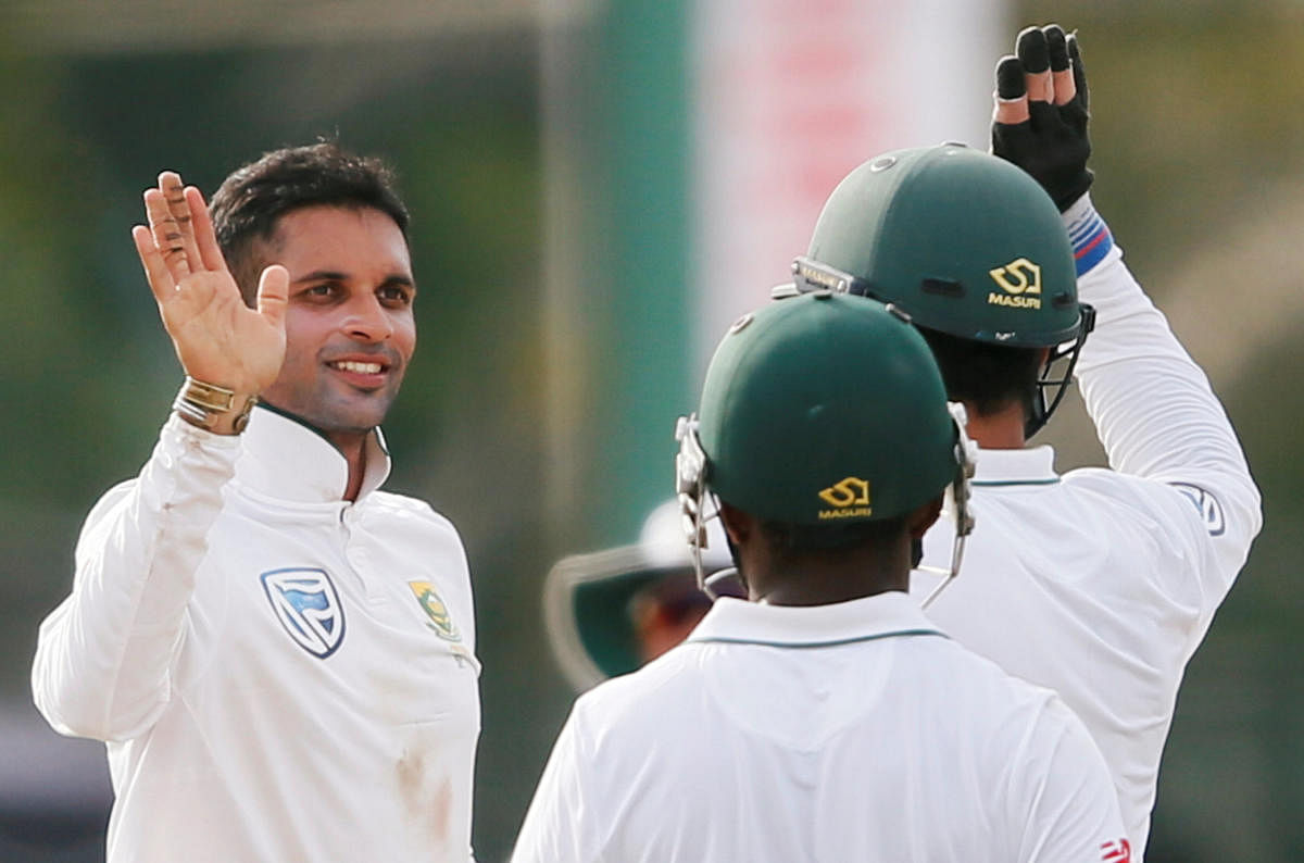 KILLER INSTINCT: South Africa's Keshav Maharaj (left) celebrates with his team-mates after taking the wicket of Sri Lanka's Niroshan Dickwella. Reuters