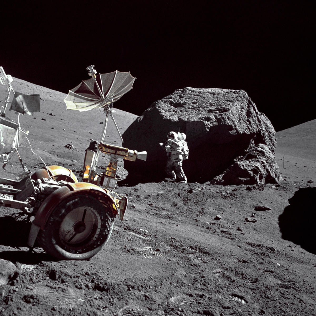 EXPEDITION: Astronaut Harrison H Schmitt at the Taurus-Littrow landing site during the third Apollo 17, EVA-3. The Rover LRV is in the left foreground. EUGENE A CERNAN/NASA