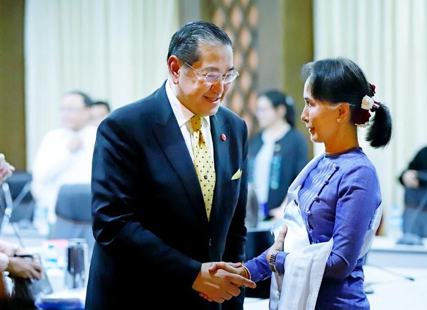 In picture: Aung San Suu Kyi and retired Thai lawmaker and ambassador Kobsak Chutikul. Photo via Twitter.  
