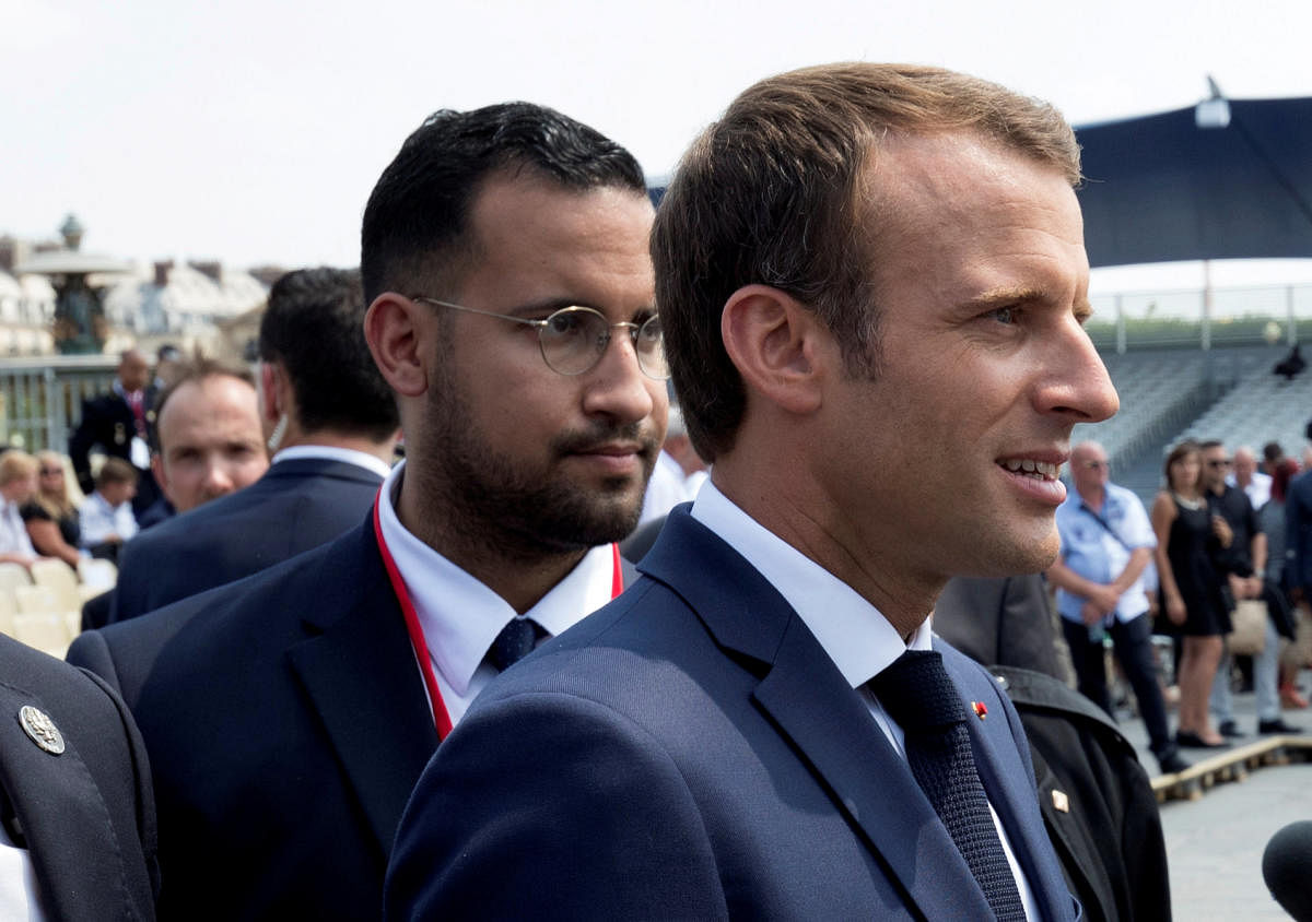 French President Emmanuel Macron walks ahead of his aide Alexandre Benalla at the end of the Bastille Day military parade in Paris. Reuters file photo.