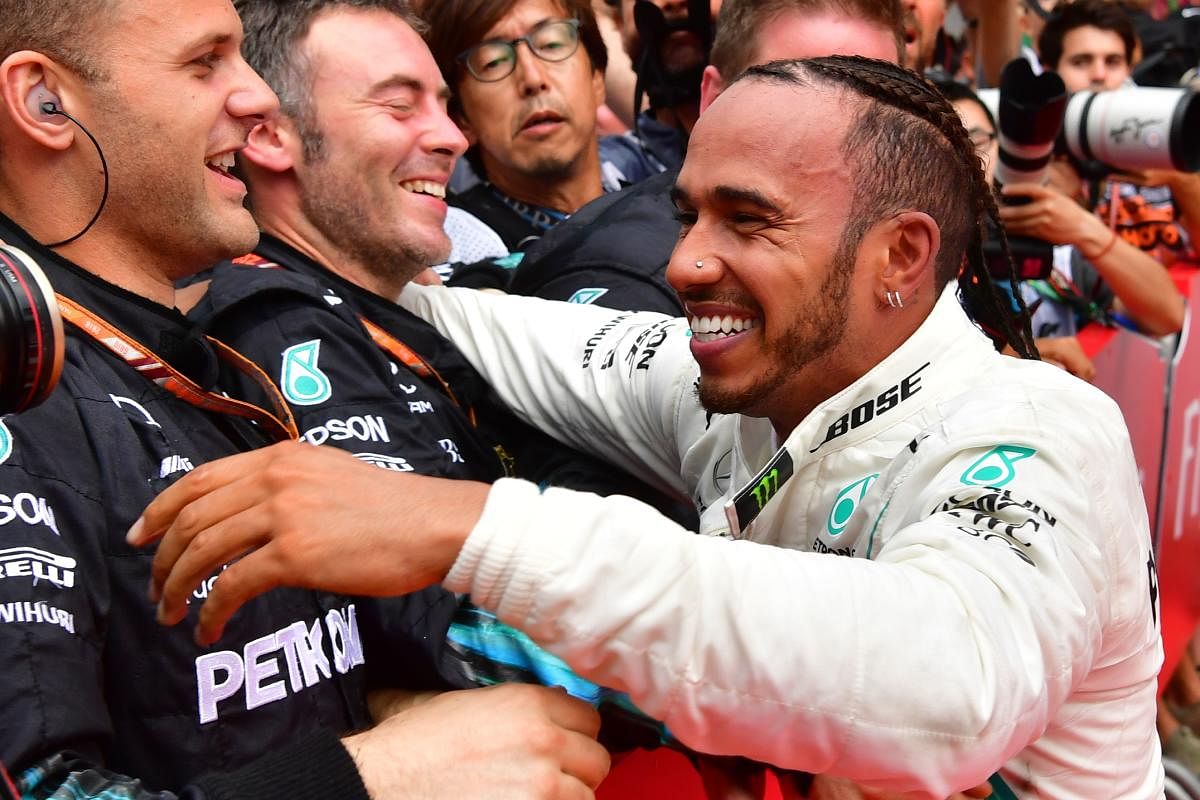 BACK ON TOP: Mercedes’ Lewis Hamilton celebrates after winning the German Grand Prix on Sunday. REUTERS