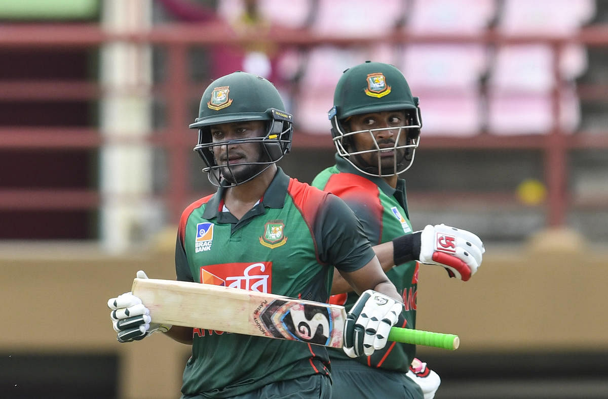 Shakib Al Hasan (left) and Tamim Iqbal of Bangladesh forged an alliance of 207 for the second wicket against West Indies. AFP 