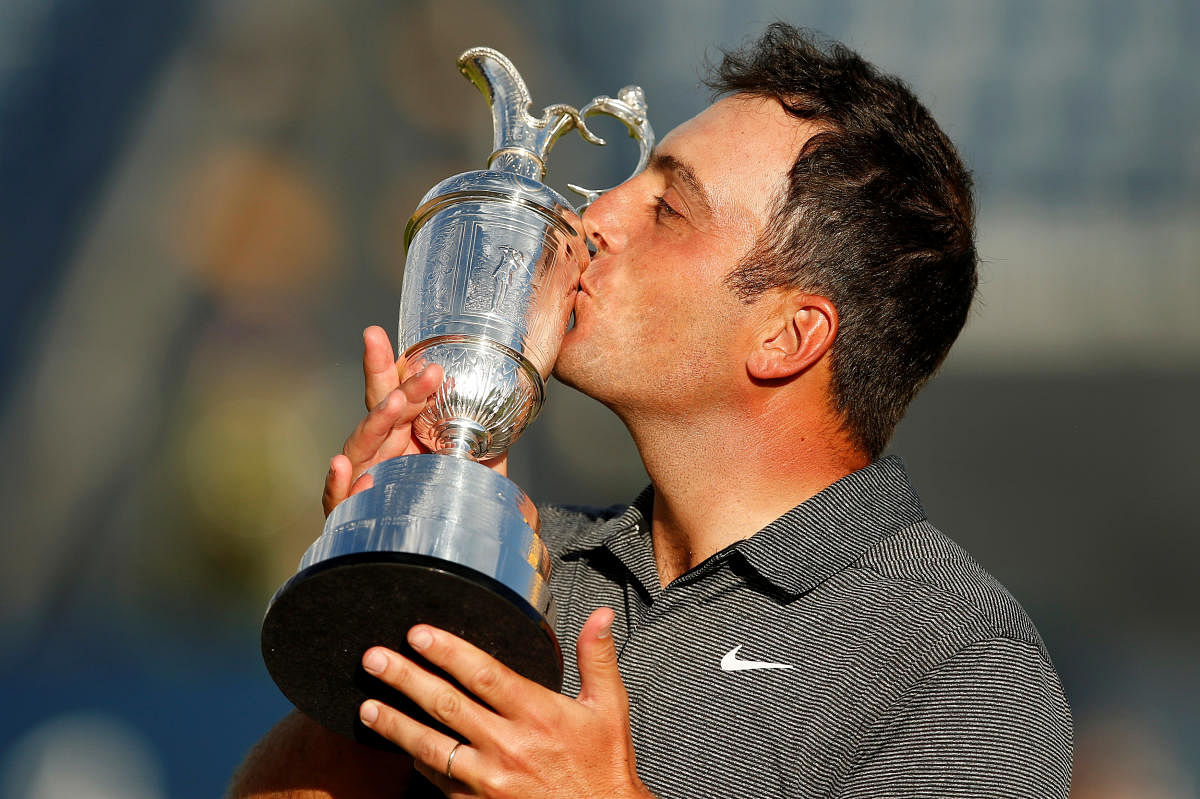 SWEET SUCCESS: Francesco Molinari celebrates with the Claret Jug after winning the 147th Open Championship. Reuters