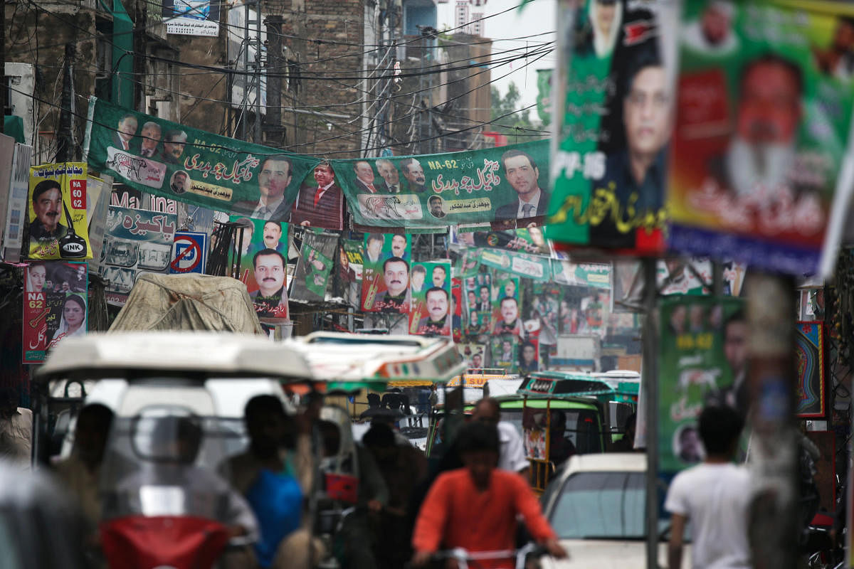 A street is decorated with flags and banners of political parties ahead of a general election in Rawalpindi. Reuters photo