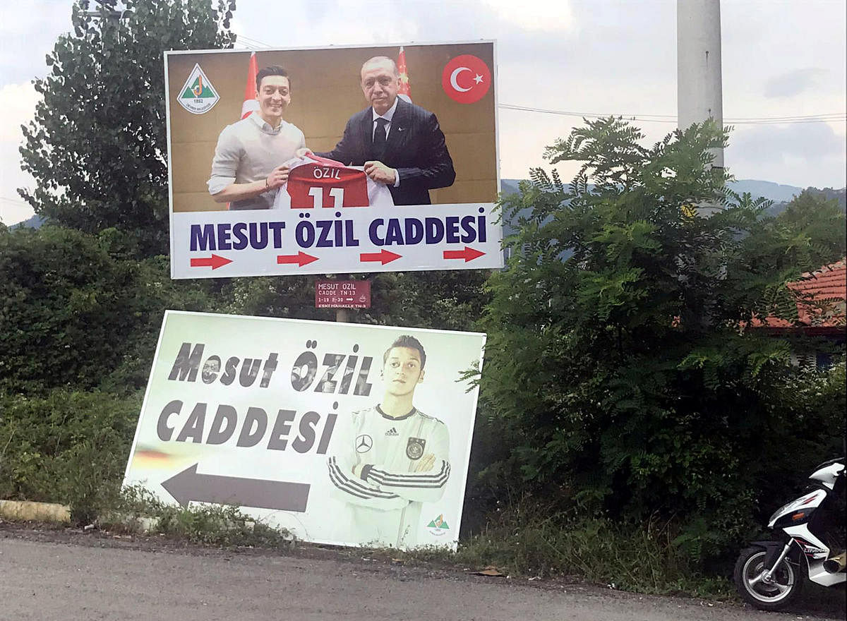 FINDING SUPPORT A billboard with a picture of Mesut Ozil and Turkish President Tayyip Erdogan in the Black Sea town of Devrek in Zonguldak in Tuekey, serves as a street sign. Reuters