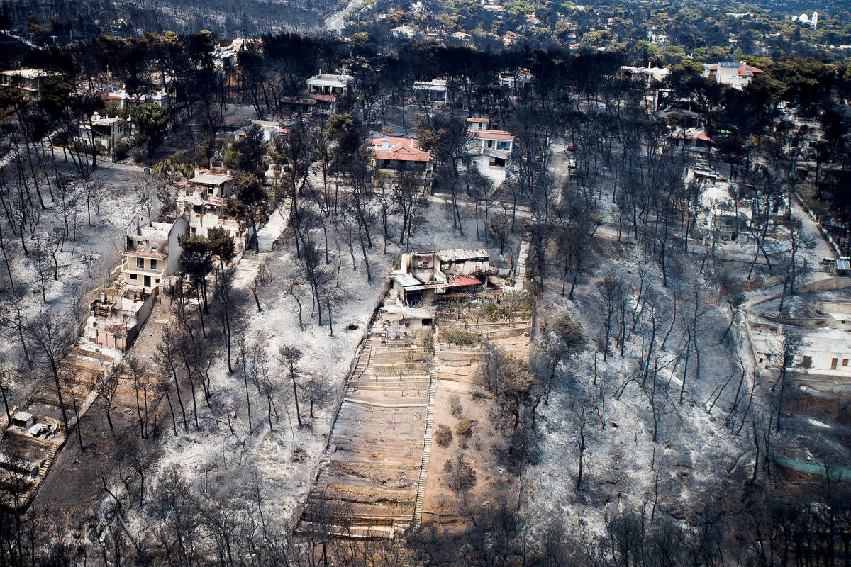An aerial view shows burnt houses and trees following a wildfire in the village of Mati, near Athens, Greece. Reuters/Antonis Nicolopoulos.