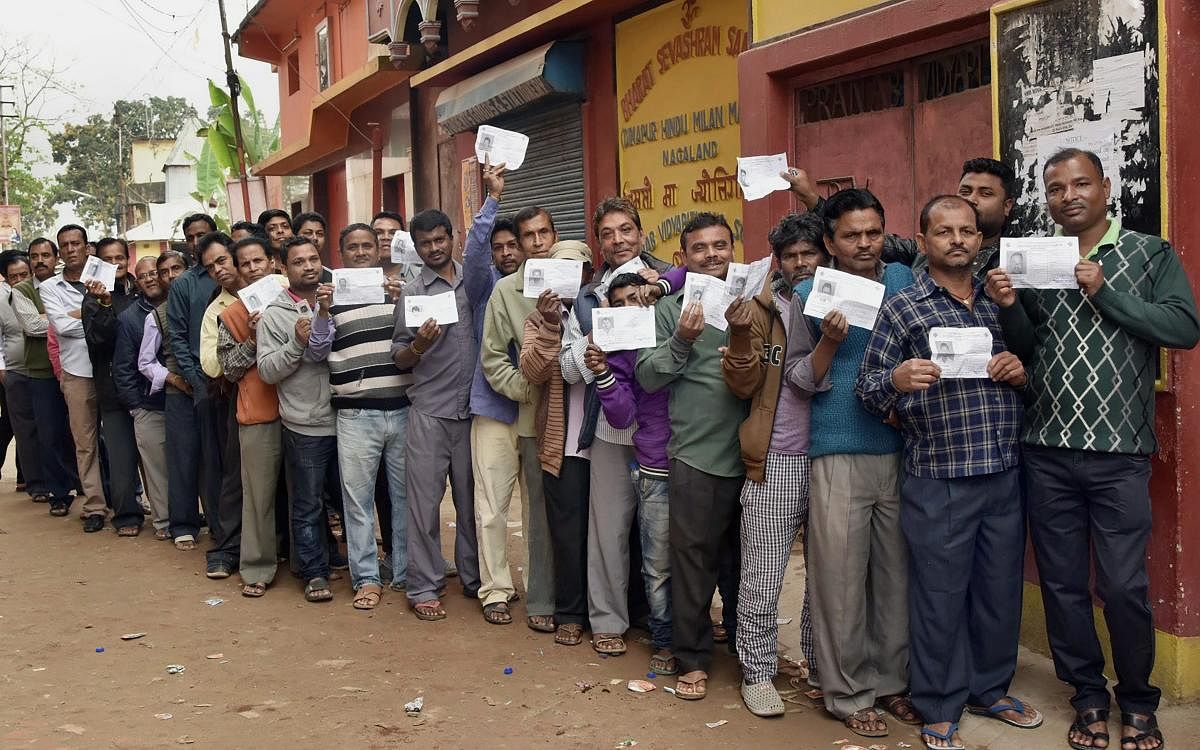 Voters wait in a long queue to cast their votes for Assembly elections, at a polling station in Dimapur, Nagaland on Tuesday. (PTI Photo)