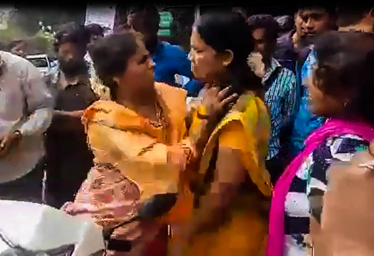 A TV grab shows a Gujarati woman arguing with Kannada activists near Hessaraghatta on Thursday afternoon.