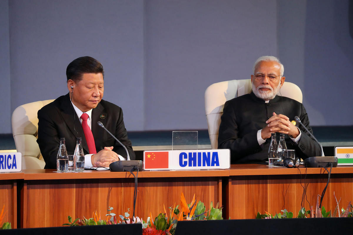 Indian Prime Minister Narendra Modi and China's President Xi Jinping attend the BRICS summit meeting in Johannesburg. Reuters photo