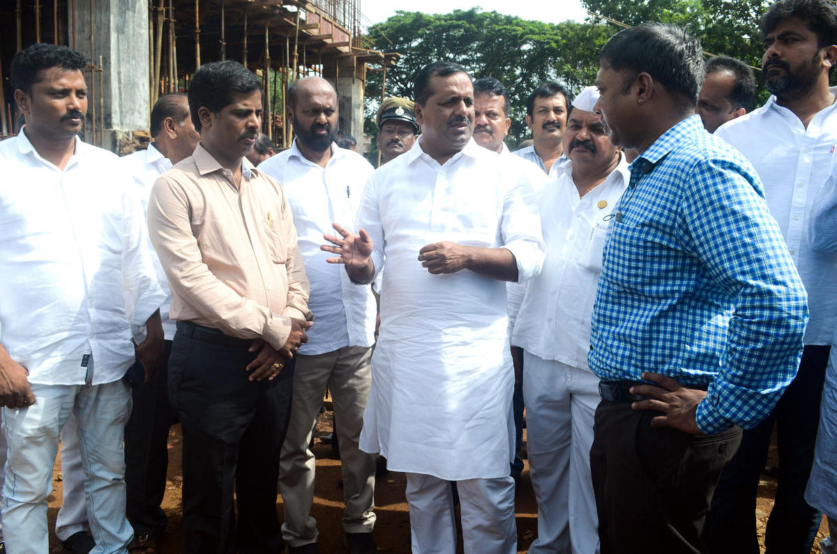 Urban Development and Housing Minister U T Khader visits the site of the new DC office complex at Padil on Friday and reviews the progress of the work.DC Sasikanth Senthil, Additional Deputy Commissioner Kumar and other officers look on.