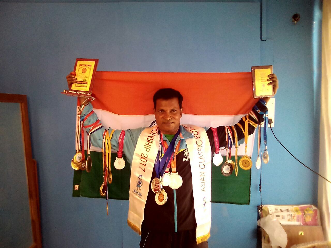 N Eshwara has 50 gold medals for powerlifting.