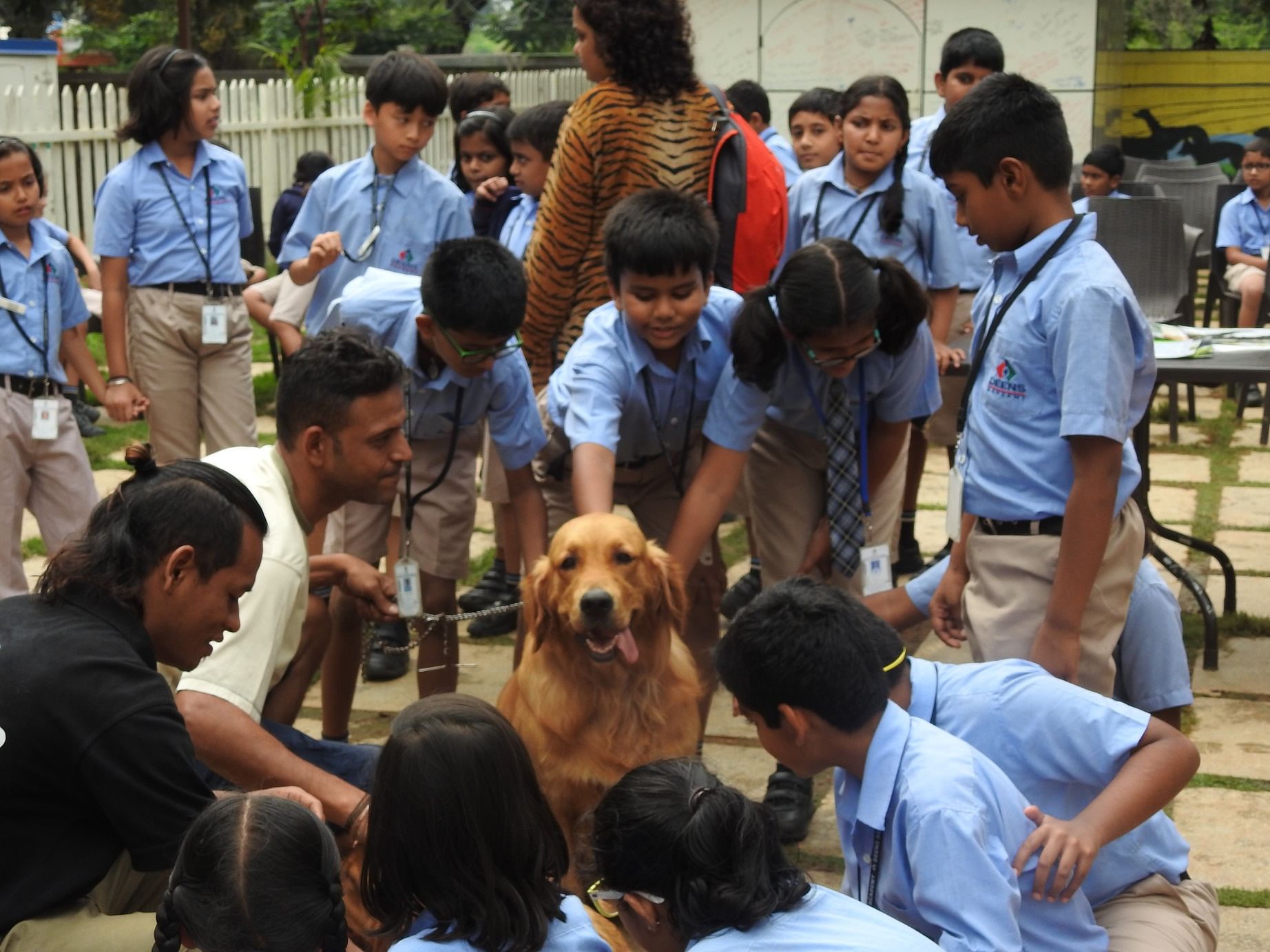 Vinayak Chaturvedi (in white T-shirt) with students from The Deens Academy during a pet therapy session.