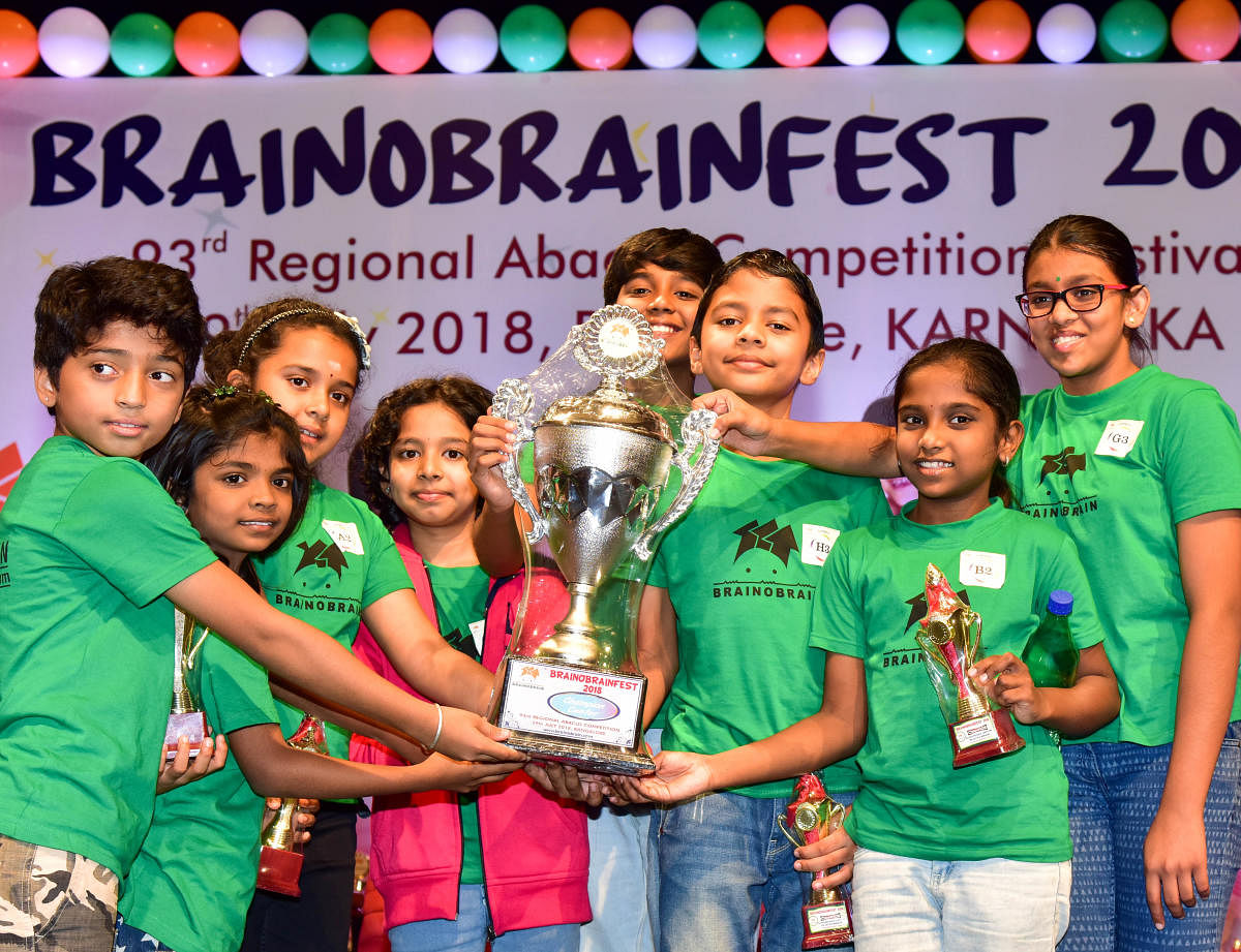 Children from Brainobrain, Rajajinagar, who won the overall trophy at the mental arithmetic calibre competition on Sunday. DH PHOTO/ B H Shivakumar