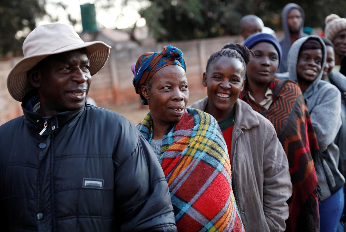 Zimbabwean voters queue to cast their ballots in the country's general elections in Harare, Zimbabwe on Monday. (REUTERS/Mike Hutchings)