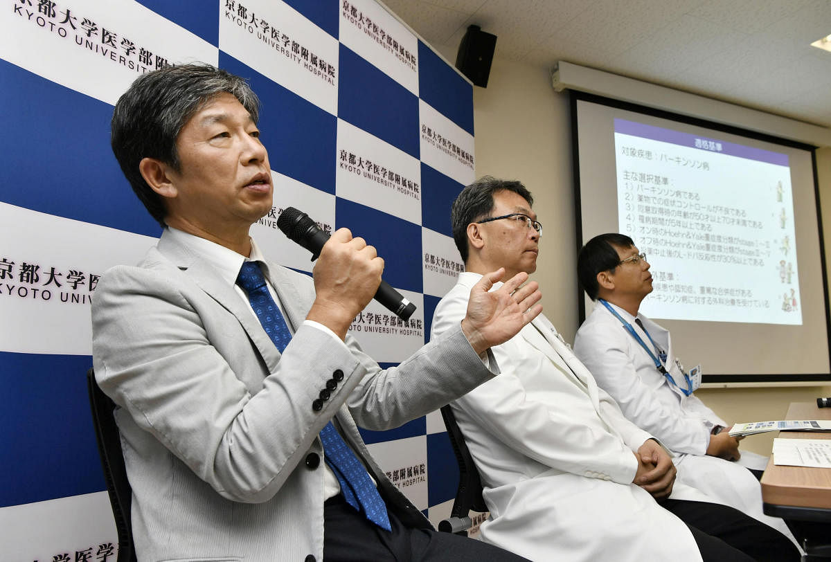 Jun Takahashi (L), professor at Kyoto University's Center for iPS Cell Research and Application, attends a news conference in Kyoto, Japan, in this photo taken by Kyodo on July 30, 2018. (Kyodo/via REUTERS)