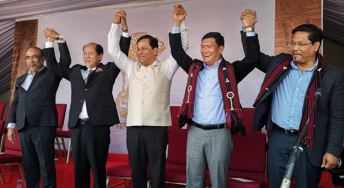 Kohima: Newly-appointed Nagaland CM Neiphiu Rio, Assam CM Sarbananda Sonowal, Manipur CM N Biren Singh, Arunachal Pradesh CM Pema Khandu and Meghalaya CM Conrad Sangma during Nagaland CM's swearing-in ceremony in Kohima on Thursday. PTI Photo (PTI3_8_2018