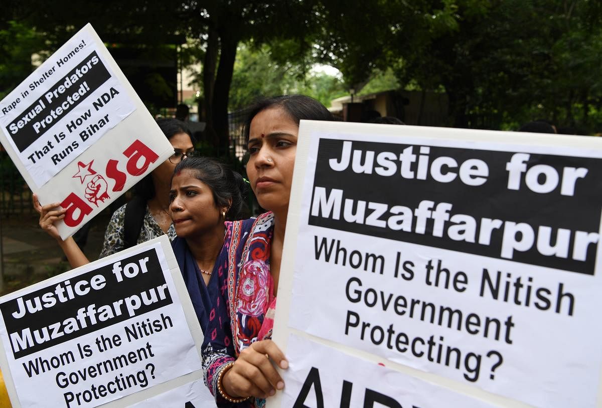 Indian activist hold placards as they take part in a protest over the sexual assault of girls at a state-run home in eastern India city, near Bihar Bhawan in New Delhi on July 30, 2018. Police in eastern India were on July 23 digging up the grounds of a s