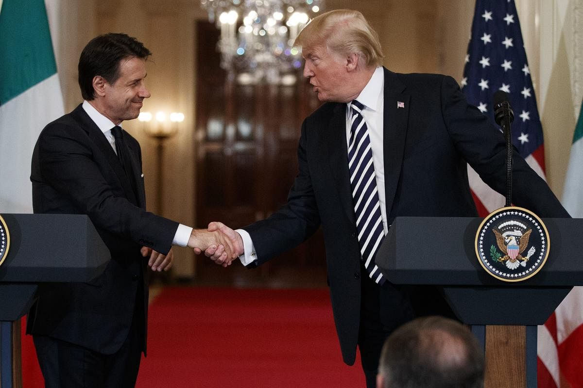 Donald Trump shakes hands with Italian Prime Minister Giuseppe Conte during a news conference in the East Room of the White House. AP/PTI photo.