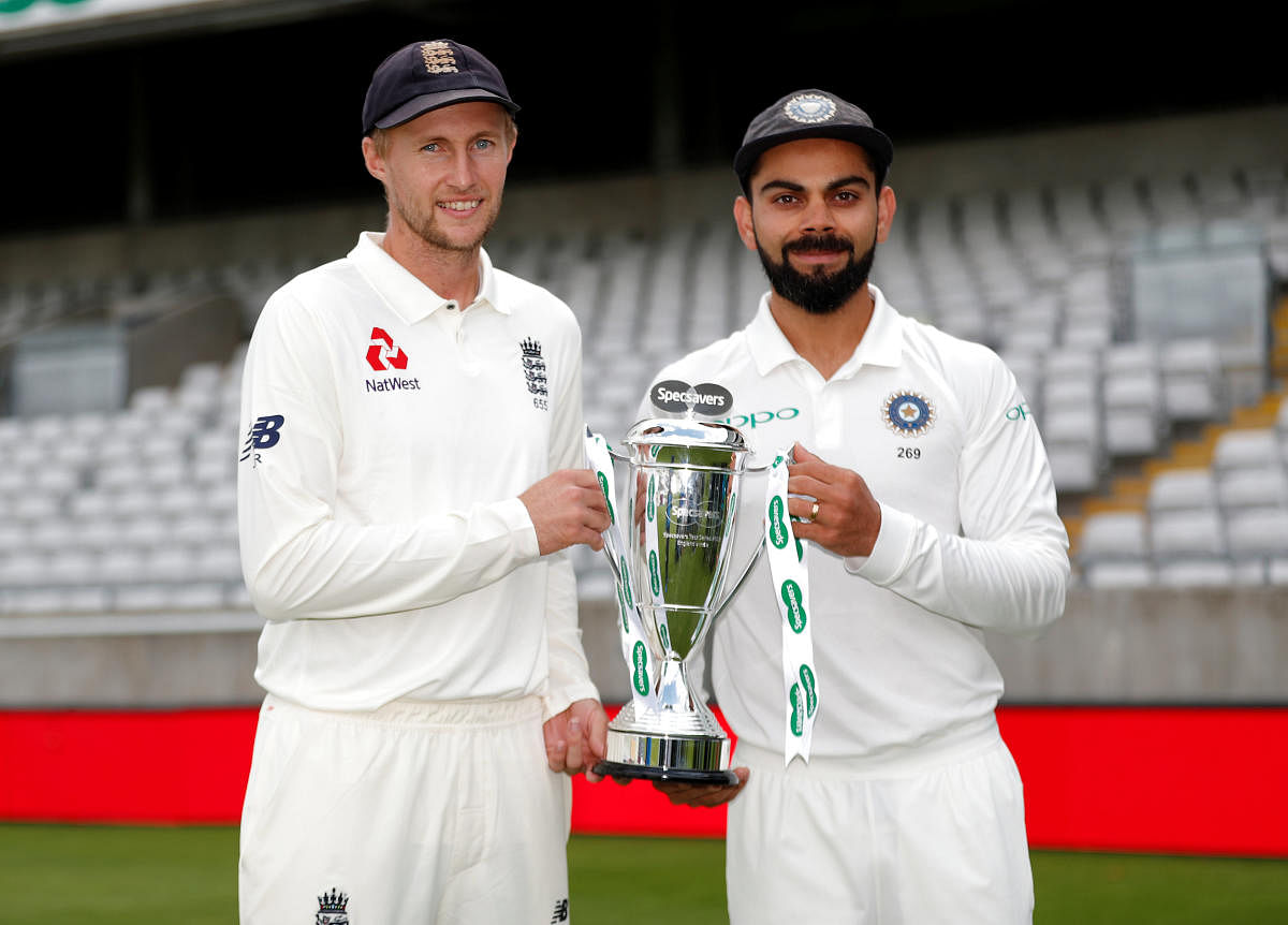  England skipper Joe Root and his Indian counterpart Virat Kohli pose with the trophy on Tuesday, ahead of the first Test beginning at Edgbaston. Reuters 
