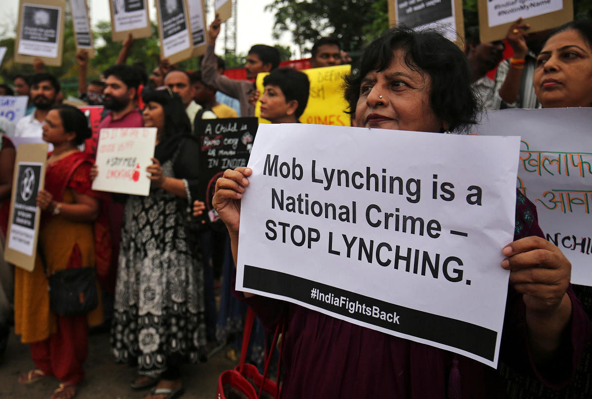 People shout anti-government slogans during a protest against what the demonstrators say are recent mob lynchings across the country, in Ahmedabad, India, July 23, 2018. REUTERS/Amit Dave