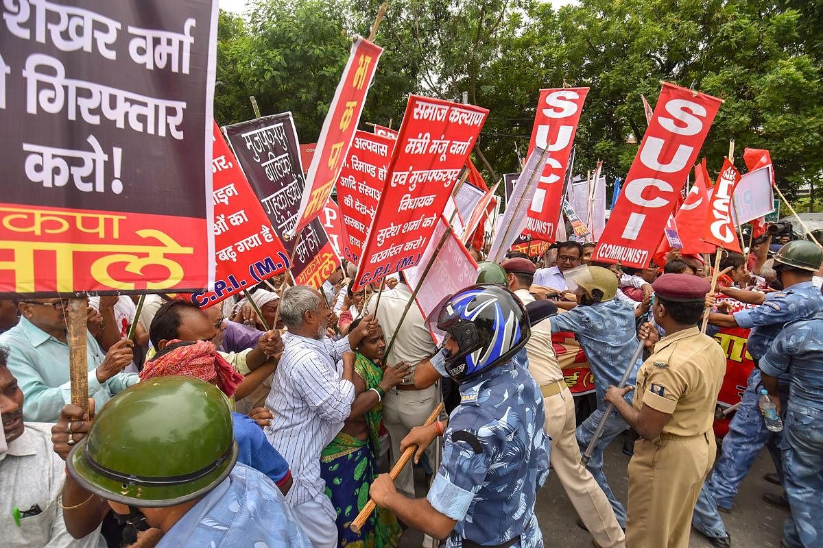Left party activists clash with police personnel during 'Bihar Bandh' protest over the recent cases of women exploitation and other crimes, in Patna on Thursday. PTI