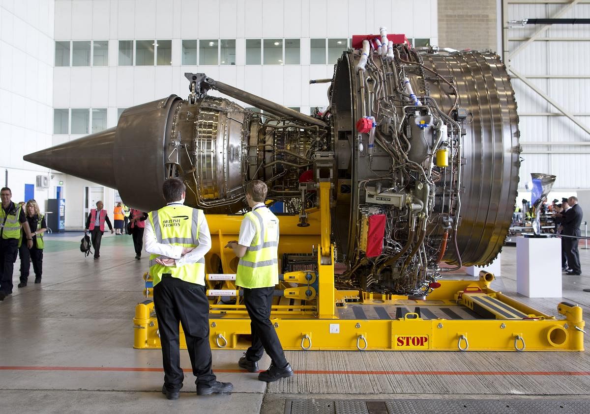 Staff look at a Rolls-Royce Trent 1000 turbofan engine during an event to mark the arrival of a British Airways Airbus A380 at Heathrow Airport in London. (AFP File Photo)