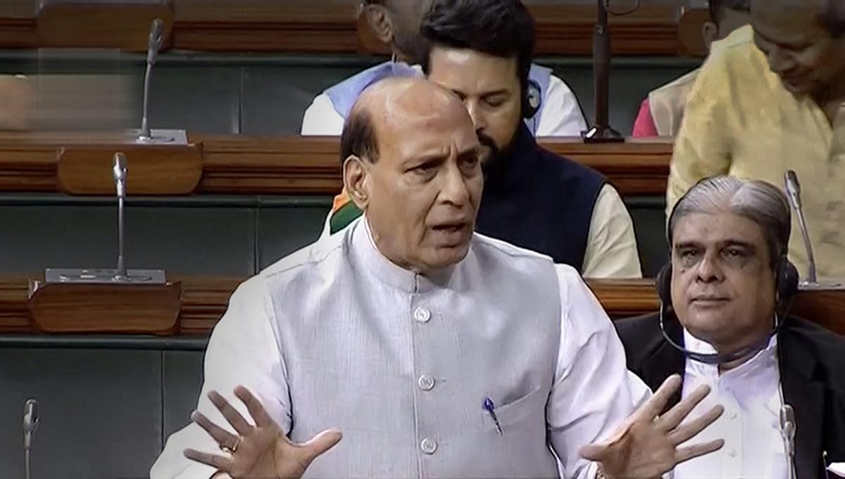  Union Home Minister Rajnath Singh speaks in the Lok Sabha during the Monsoon session of Parliament, in New Delhi on Thursday, Aug 2, 2018. (LSTV Grab via PTI)