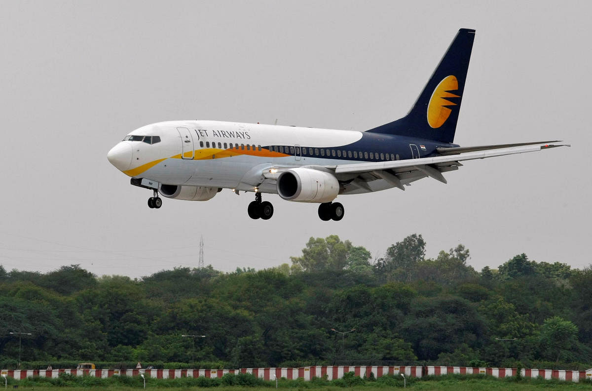 FILE PHOTO: A Jet Airways passenger aircraft prepares to land at the airport in the western Indian city of Ahmedabad, India August 12, 2013. REUTERS/Amit Dave/File photo