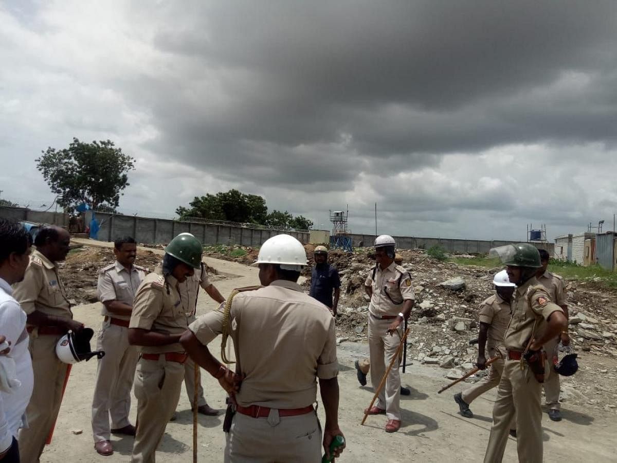 Policemen deployed near Sri Cement Factory near Kodla in Sedam taluk. DH Photo