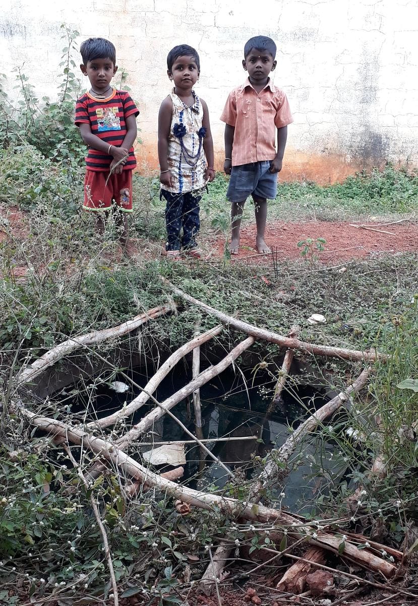 Poorvika (5) with Deepak (5) and Satwik (6) near the sump at Appegowdanahalli in Shidlaghatta taluk. 