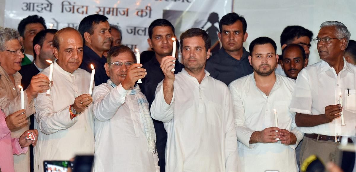 (L-R) CPI (M) leader Sitaram Yechury, TMC leader Dinesh Trivedi, Loktantrik Janata Dal leader Sharad Yadav, Congress President Rahul Gandhi, CPI leader D Raja and others during a protest over the issue of alleged sexual abuse at a government-funded shelte