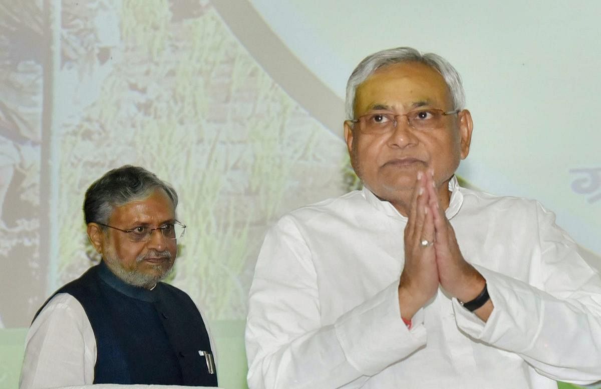 Bihar Chief Minister Nitish Kumar with Deputy Chief Minister Sushil Kumar Modi during the launch of Sustainable Livelihoods scheme for prohibition-affected families, at Adhiveshan Bhawan in Patna on Sunday. PTI