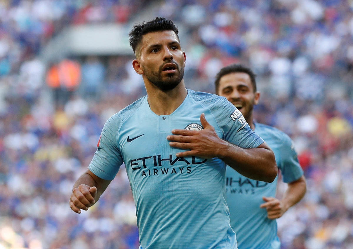 Ruthless: Manchester City's Sergio Aguero celebrates after scoring their second goal against Chelsea on Sunday. Reuters