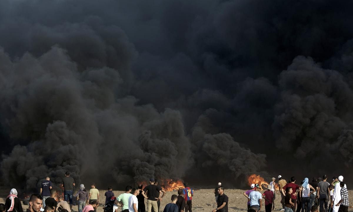 Palestinian protesters gather during a protest at the Gaza Strip's border with Israel.